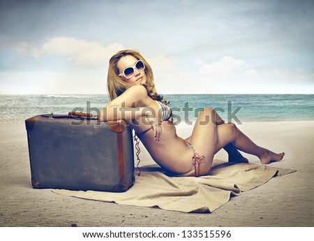 blonde woman with bikini on the beach