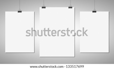 three blank poster clips on white background