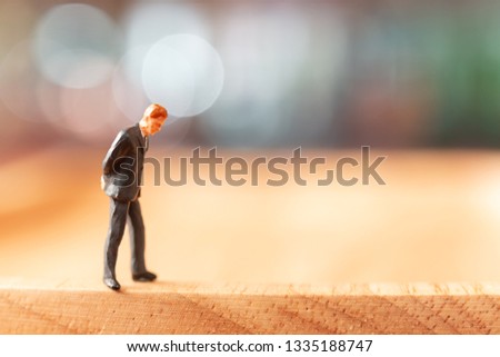 Miniature people : Businessman  standing and thinking with colorfull background