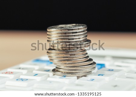 stack of coins and calculator,concept idea for business finance