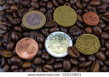 fair trade coffee Price - roasted coffee beans and money