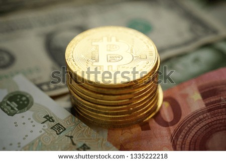 Bitcoins on a dollar banknotes.