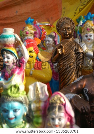 Street shop of handmade statue of indian idol at rural village annual fair.