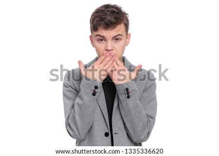 I do not see, do not speak, can not hear anything - full length portrait of young caucasian teen boy. Funny teenager 14 year old. Handsome child isolated on white background.