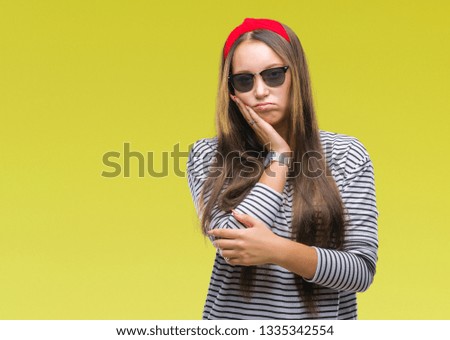 Young beautiful caucasian woman wearing sunglasses over isolated background thinking looking tired and bored with depression problems with crossed arms.