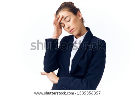 Business woman in a suit holding her head depression