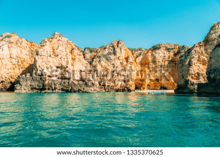 Ocean Landscape With Rocks And Cliffs At Lagos Bay Coast In Algarve, Portugal
