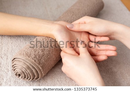 Women hand got a hand massaged Royalty-Free Stock Photo #1335373745