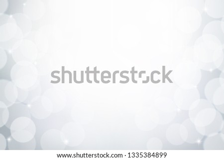 White and grey bokeh effect, Winter blurred background, Abstract snowy concept backdrop.