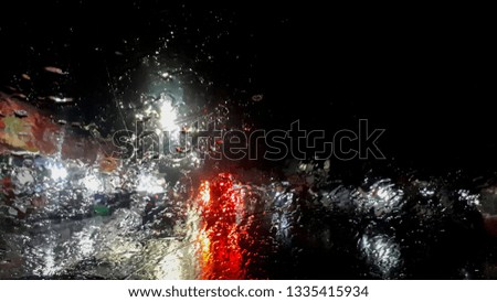 Rain of wet glass in the car window