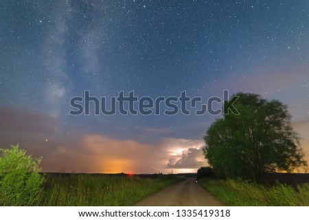 Distant thunderstorm against the starry sky