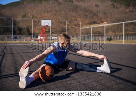 Basketball player doing stretching
