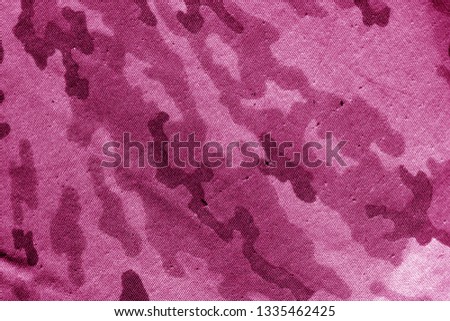 Dirty camouflage cloth in pink tone. Abstract background and texture for design abd ideas.