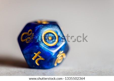 Astrology Dice with symbol of the Sun on grey background