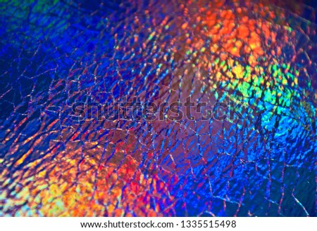 Blurred background with bokeh. Holographic background. Rainbow background. Spectrum color.