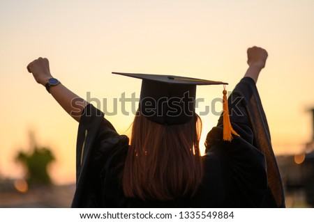 Graduates wear a black dress, black hat at the university level. Royalty-Free Stock Photo #1335549884
