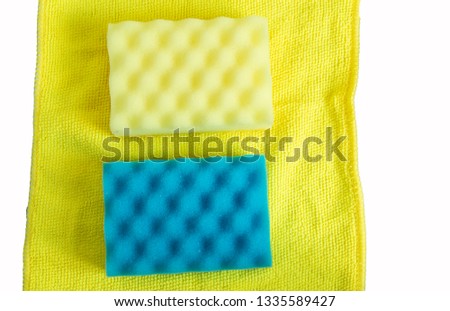 Sponge set and yellow cleaning cloth, on white background with clipping path, flat lay
