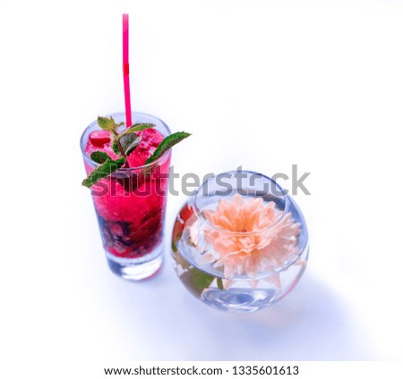 Meditation floral composition of strawberry mojito and  lotus flower in water glass bowl