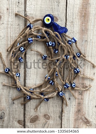 evil eye beads on wooden background