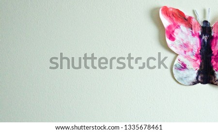 Paper Butterfly on White Wall