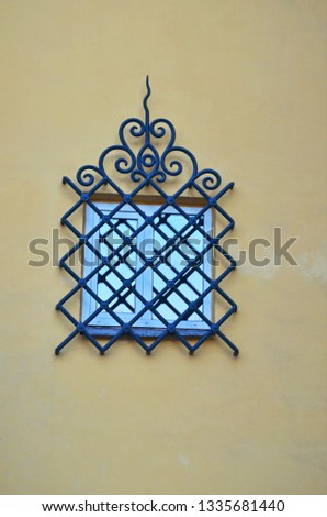 Decorative protective screen at a window