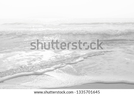 Sand beach and wave bubbles. The picture of the beautiful of wave and sand on the beach was adjust to be abstract picture make relax feeling.