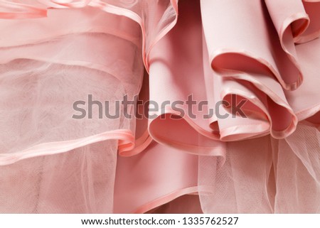 Wedding dress detail. Pink wedding dress frills close up. 