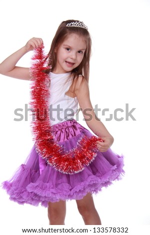 Studio image of pretty joyful kid girl on Holiday