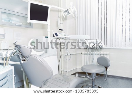 Interior of the office of patients reception with dental equipment in the dental clinic. Royalty-Free Stock Photo #1335783395