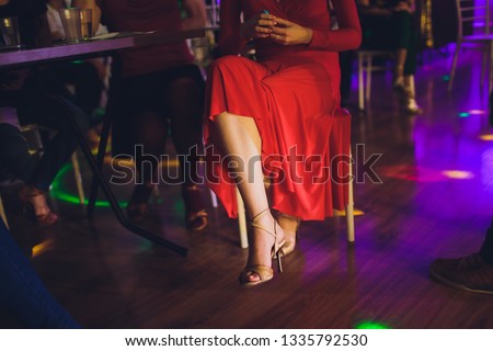 Legs of dancing people at the party.