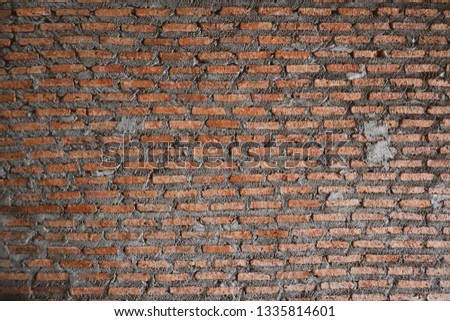 The reddish  brick wall with the old style of construction. No more plastering on the wall.
