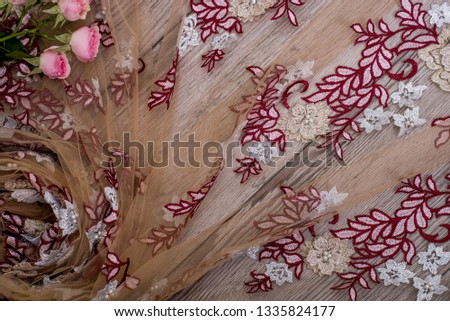 The texture of lace on wooden background