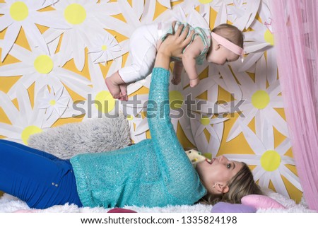 Happy loving family. mother and child girl playing, kissing and hugging. Happy mothers day.