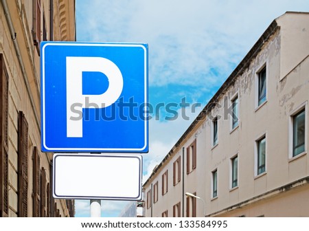 detail of a blue parking sign in a urban street