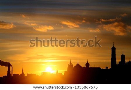 Beautiful bright landscape photo with silhouettes of the Moscow Kremlin in the evening at sunset