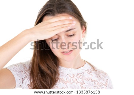 teenage girl in pain having headache hand on head on white background