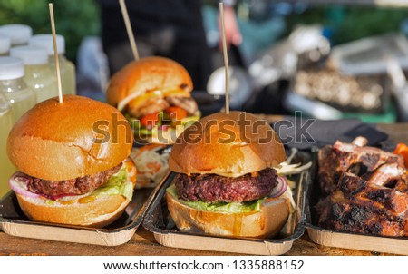 Street food hamburgers closeup outdoor at take away stall