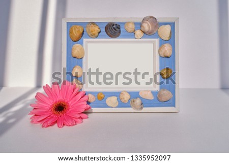 Photo frame on a background of flowers
