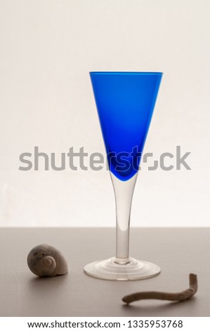 Cordial shot glass and sea shells
