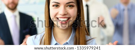 Smiling beauty businesswoman office portrait standing on group business peoples background. Demonstrates joy winning end reporting period education completion affairs and energy concept