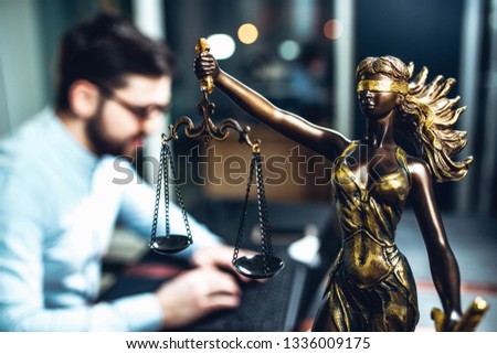 scales of justice against the background of a lawyer, a judge of the prosecutor. concept of jurisprudence