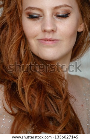Elegant woman with red hair