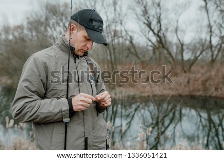 Young man is fishing
