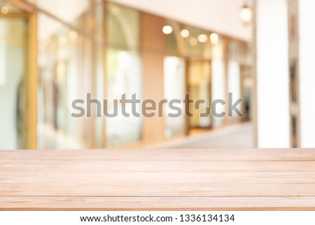 Empty of wood table with blur The walk way or corridor in the building for shopping or modern office inside. Background usage.