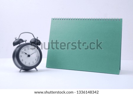 blank desktop calendar and bell clock on the white background