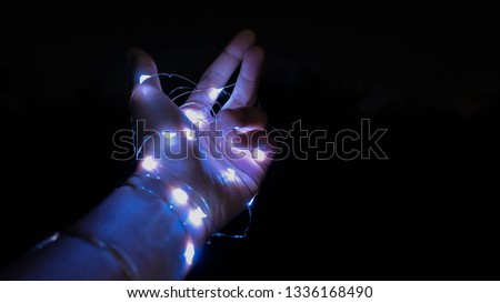 led lights with male's hand sign is   
" Come back to me ,please "