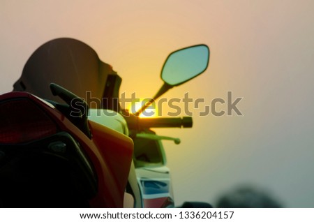  motorcycle parking on the road right side and sunset, select focusing background.