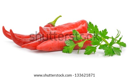 Red cayenne chili peppers and parsley isolated on the white background
