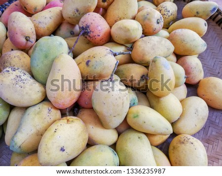 Cashew pile, mango background