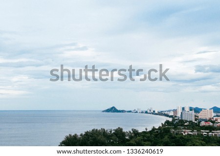Aerial view of famous Hua Hin beach and bay in evening with cityscape. Thailand tropical beach destination